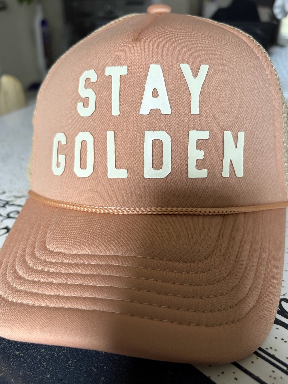 Stay Golden Tan Trucker Hat; $10